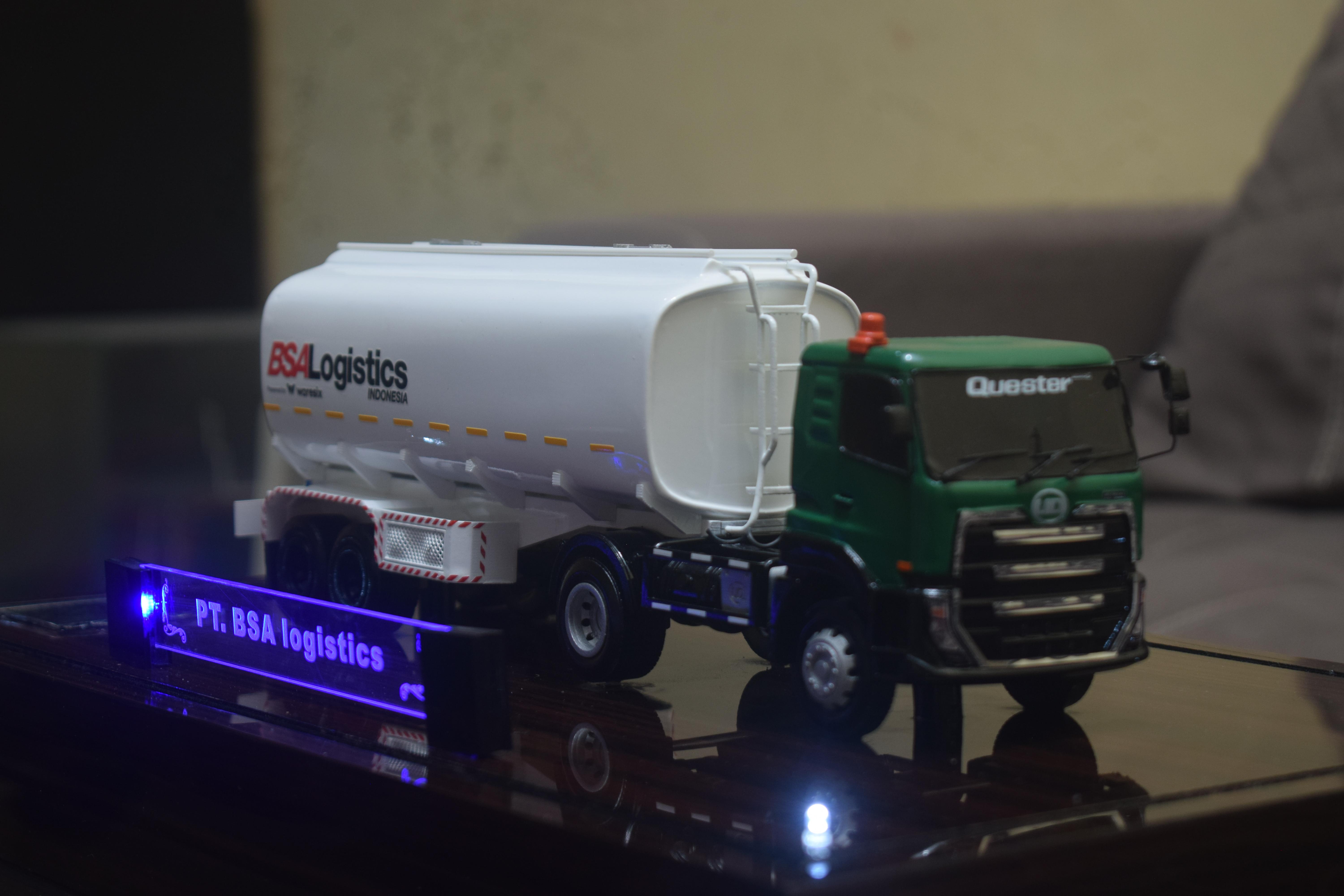 TRUK TANKI GRASI QUEESTER